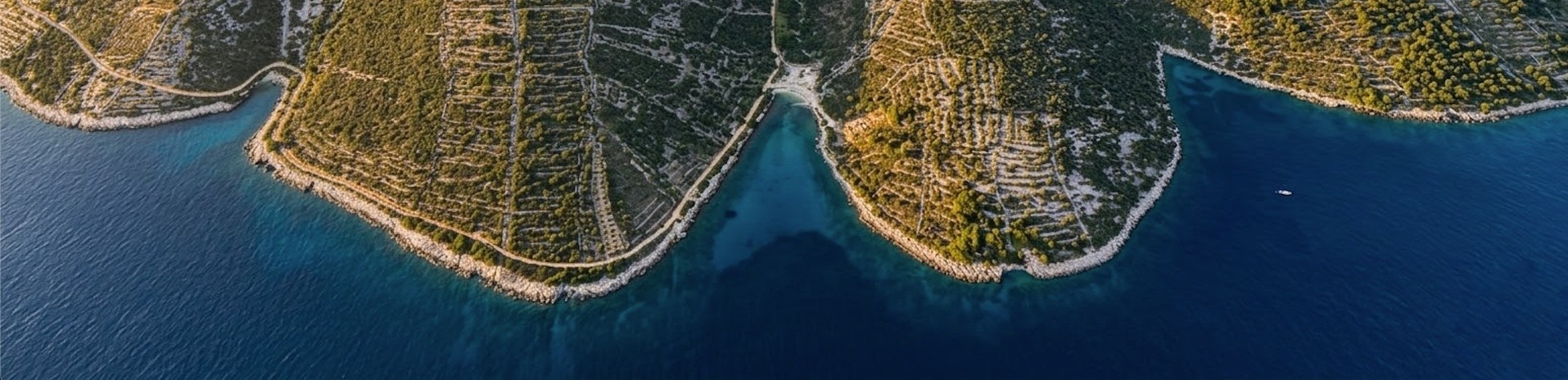 Aerial view of the rugged coastline and sheltered water at Jelinak Bay